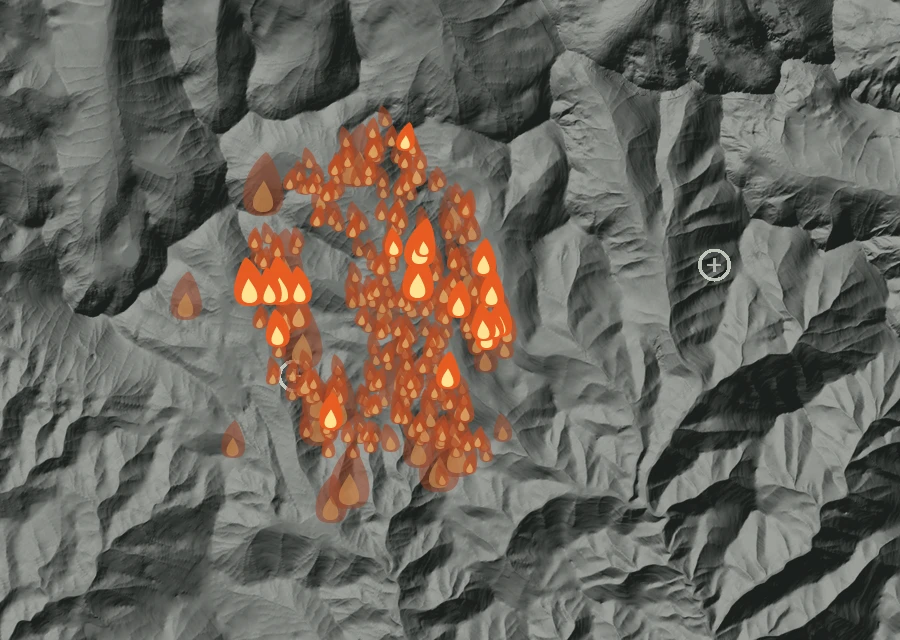 Shaded relief map of the McCulley Fire. Amber flames mark every place that gave off heat in the last day; the shading is the shape of the ground.