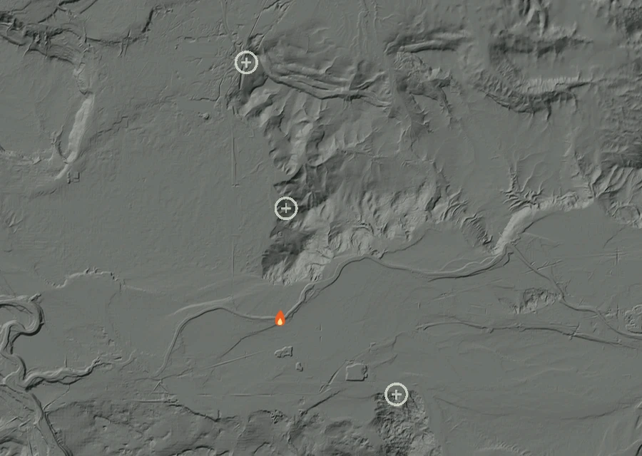 Shaded relief map of the Mckinnon Fire. Amber flames mark every place that gave off heat in the last day; the shading is the shape of the ground.
