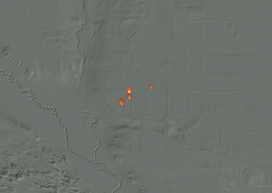 Shaded relief map of the Meyer Fire. Amber flames mark every place that gave off heat in the last day; the shading is the shape of the ground.