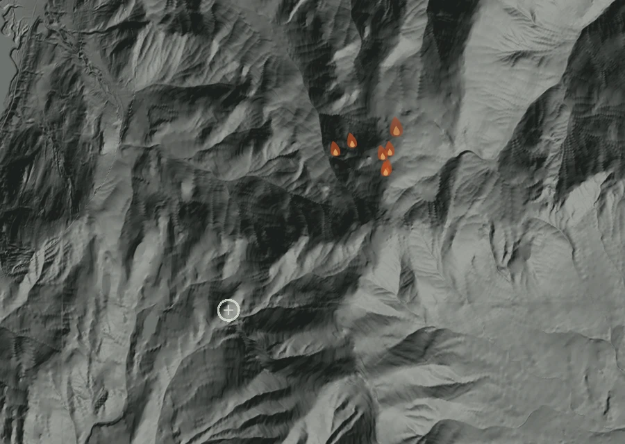 Shaded relief map of the Mingo Meadow Fire. Amber flames mark every place that gave off heat in the last day; the shading is the shape of the ground.