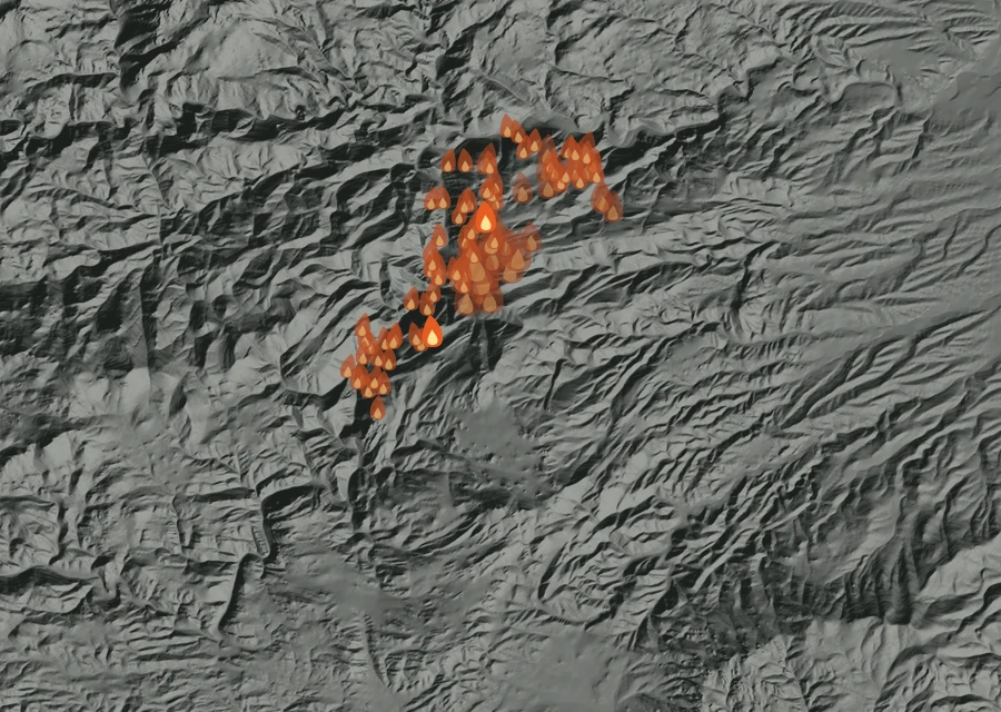 Shaded relief map of the Moonshine Fire. Amber flames mark every place that gave off heat in the last day; the shading is the shape of the ground.