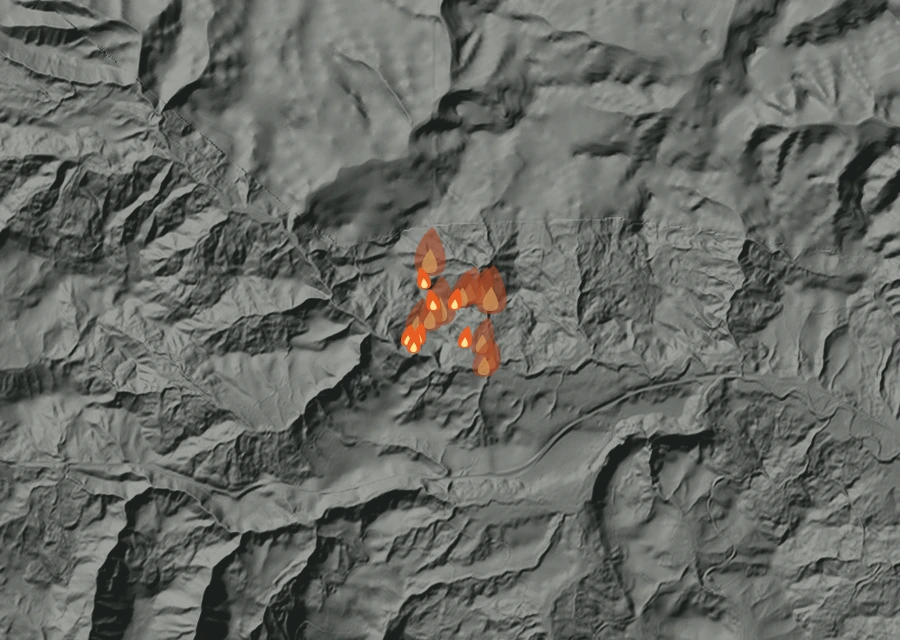 Shaded relief map of the Mor Nor Wolf Fire. Amber flames mark every place that gave off heat in the last day; the shading is the shape of the ground.