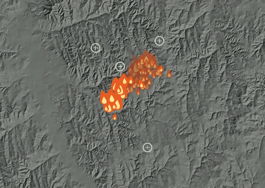 Shaded relief map of the Needles Fire. Amber flames mark every place that gave off heat in the last day; the shading is the shape of the ground.