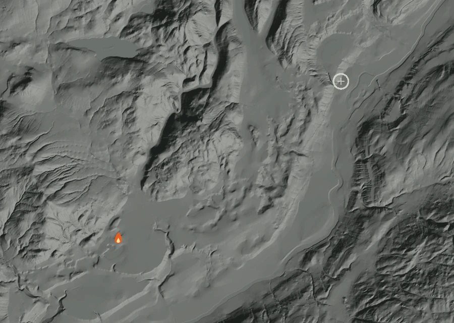 Shaded relief map of the Nickles Fire. Amber flames mark every place that gave off heat in the last day; the shading is the shape of the ground.