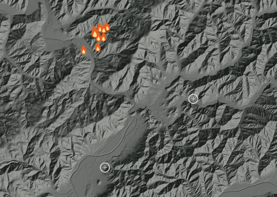 Shaded relief map of the Old Booth Fire. Amber flames mark every place that gave off heat in the last day; the shading is the shape of the ground.