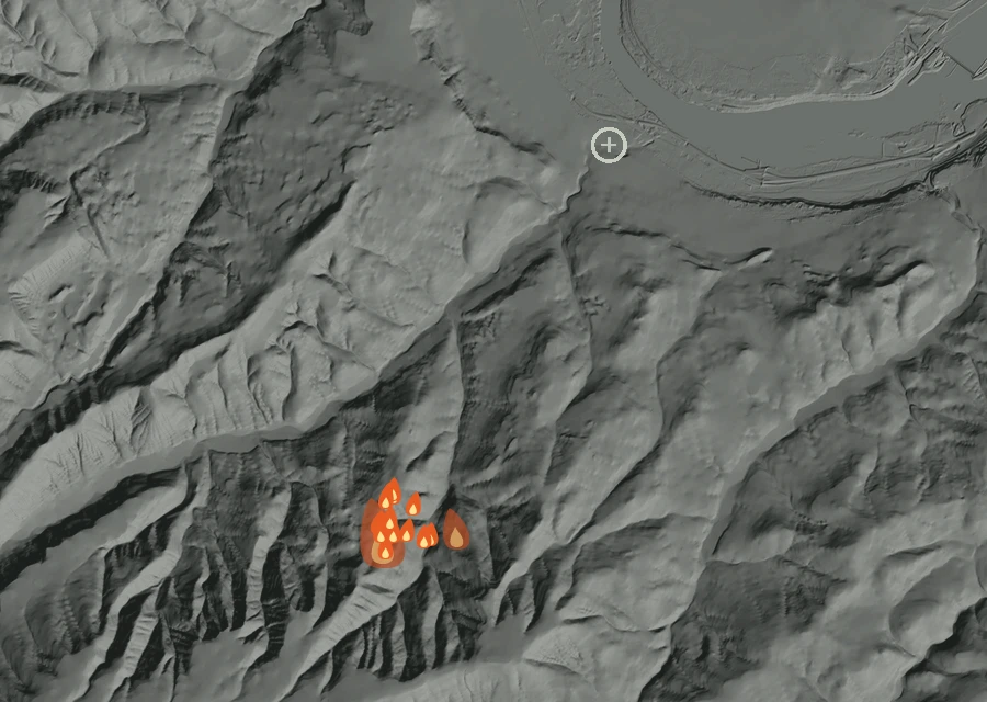 Shaded relief map of the Orchard Road Fire. Amber flames mark every place that gave off heat in the last day; the shading is the shape of the ground.