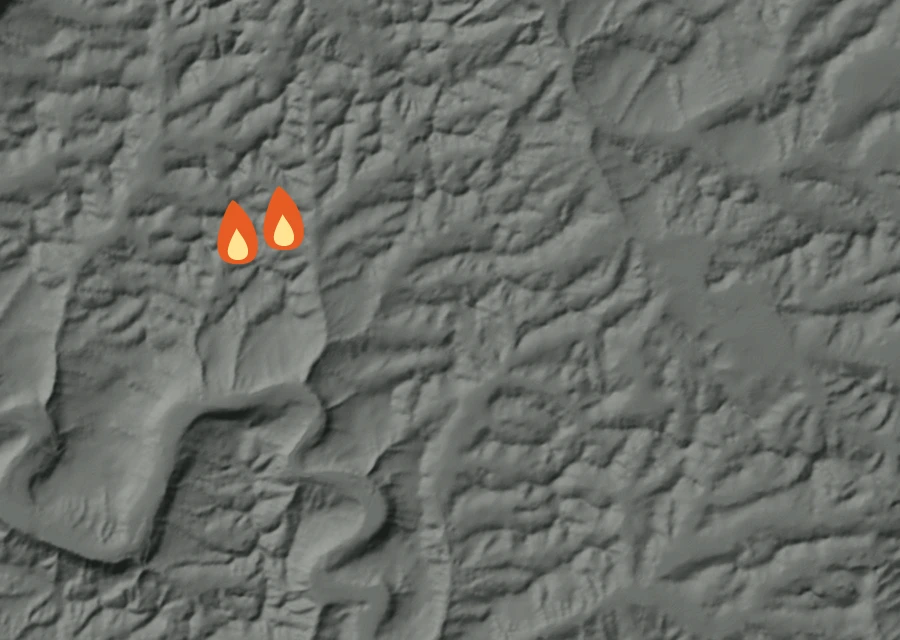 Shaded relief map of the Palouse River Fire. Amber flames mark every place that gave off heat in the last day; the shading is the shape of the ground.