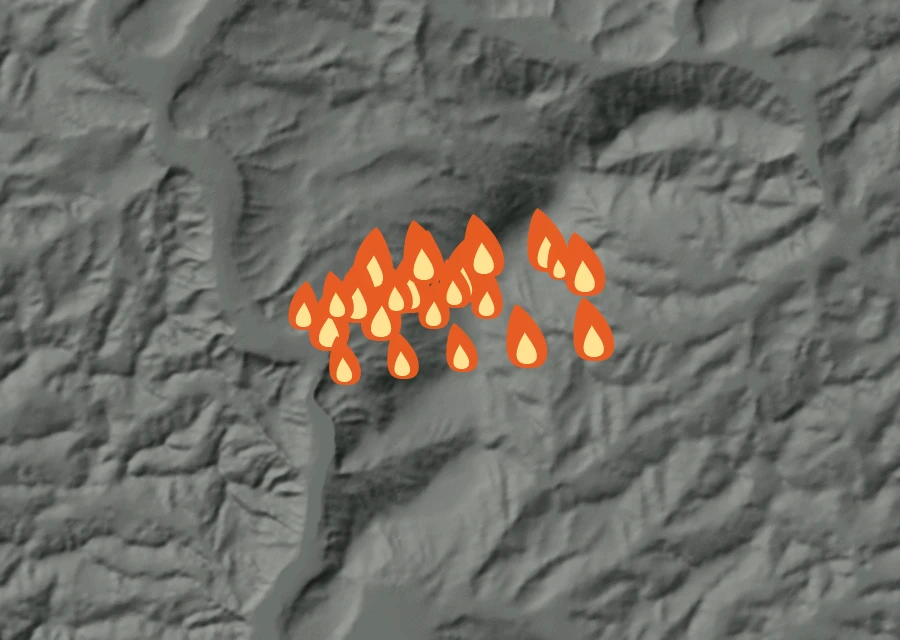 Shaded relief map of the Parvin Fire. Amber flames mark every place that gave off heat in the last day; the shading is the shape of the ground.