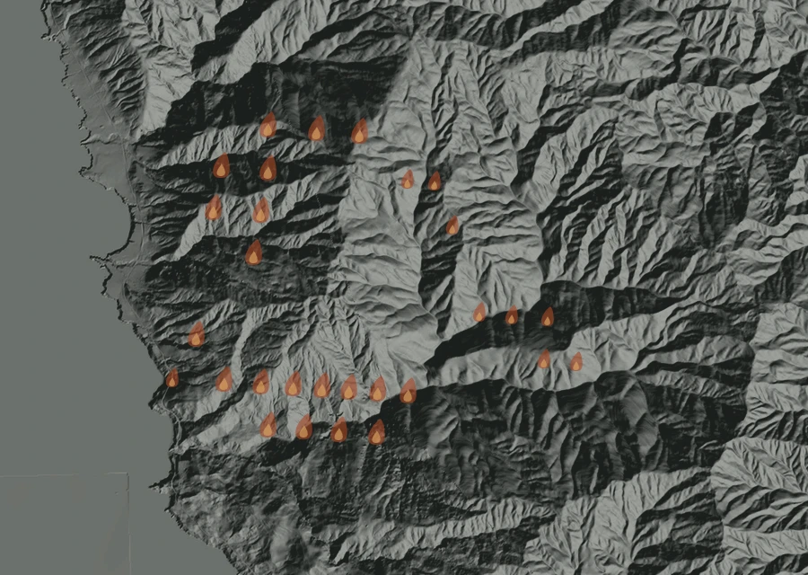 Shaded relief map of the Plaskett Fire. Amber flames mark every place that gave off heat in the last day; the shading is the shape of the ground.