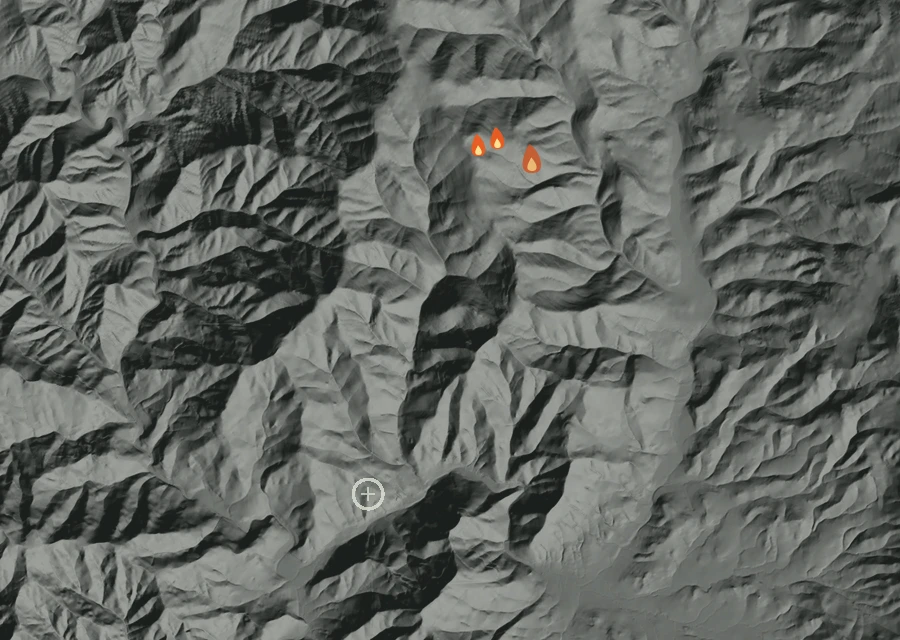 Shaded relief map of the Ramsey Canyon Rd Fire. Amber flames mark every place that gave off heat in the last day; the shading is the shape of the ground.