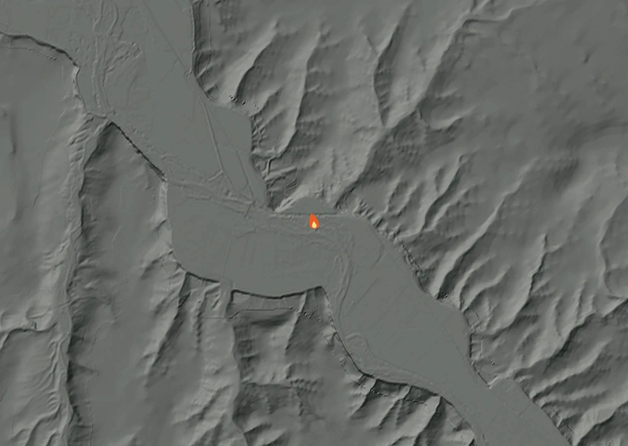 Shaded relief map of the Reese road Fire. Amber flames mark every place that gave off heat in the last day; the shading is the shape of the ground.