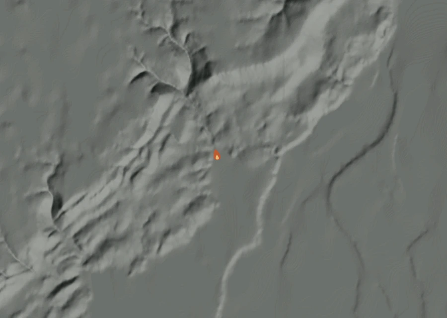 Shaded relief map of the Reservation Road Fire. Amber flames mark every place that gave off heat in the last day; the shading is the shape of the ground.