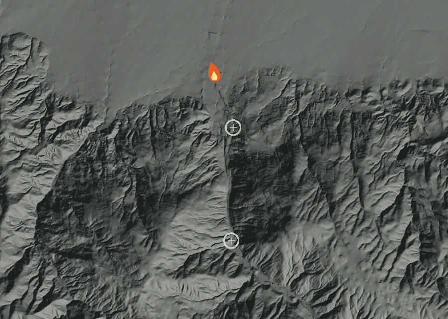 Shaded relief map of the Rose Fire. Amber flames mark every place that gave off heat in the last day; the shading is the shape of the ground.