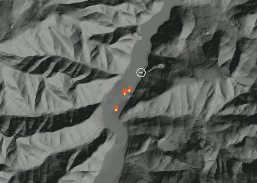 Shaded relief map of the Sand Prairie Fire. Amber flames mark every place that gave off heat in the last day; the shading is the shape of the ground.