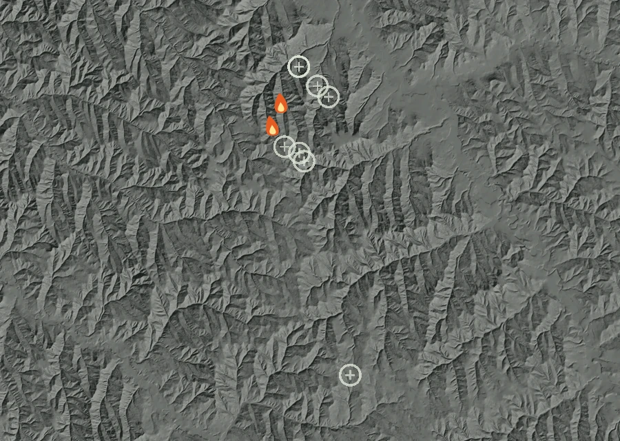 Shaded relief map of the School House Fire. Amber flames mark every place that gave off heat in the last day; the shading is the shape of the ground.