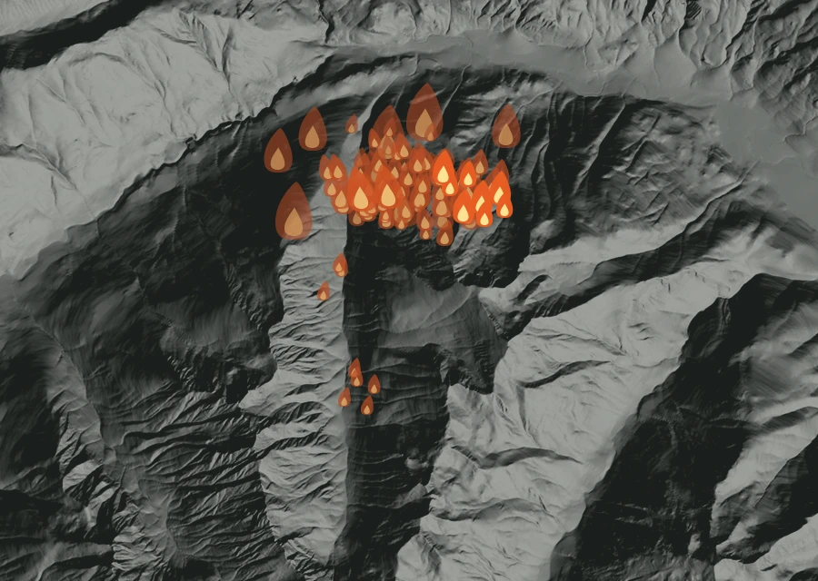 Shaded relief map of the Sisi Fire. Amber flames mark every place that gave off heat in the last day; the shading is the shape of the ground.
