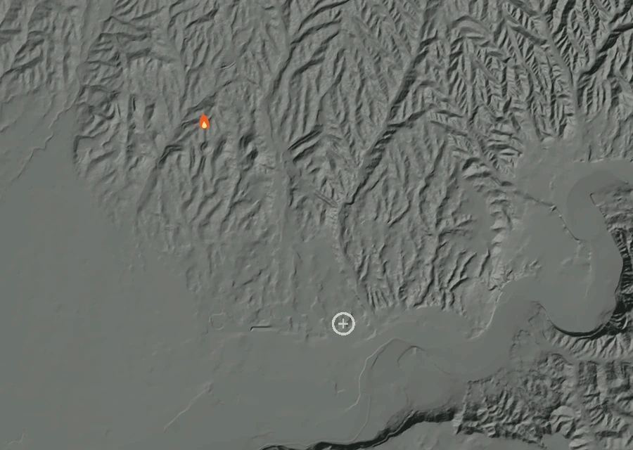 Shaded relief map of the Sister Fire. Amber flames mark every place that gave off heat in the last day; the shading is the shape of the ground.
