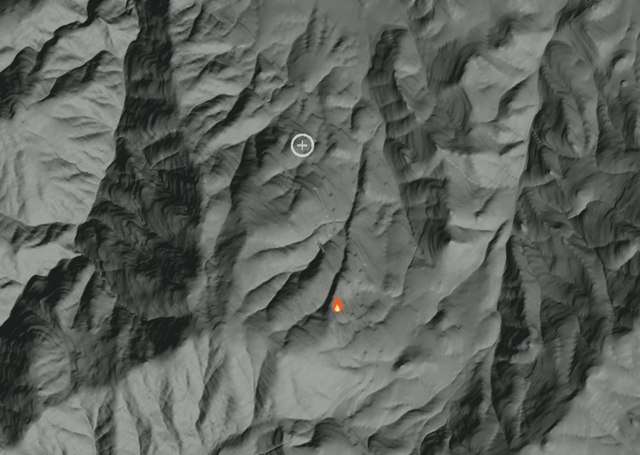 Shaded relief map of the Ski Rd Fire. Amber flames mark every place that gave off heat in the last day; the shading is the shape of the ground.