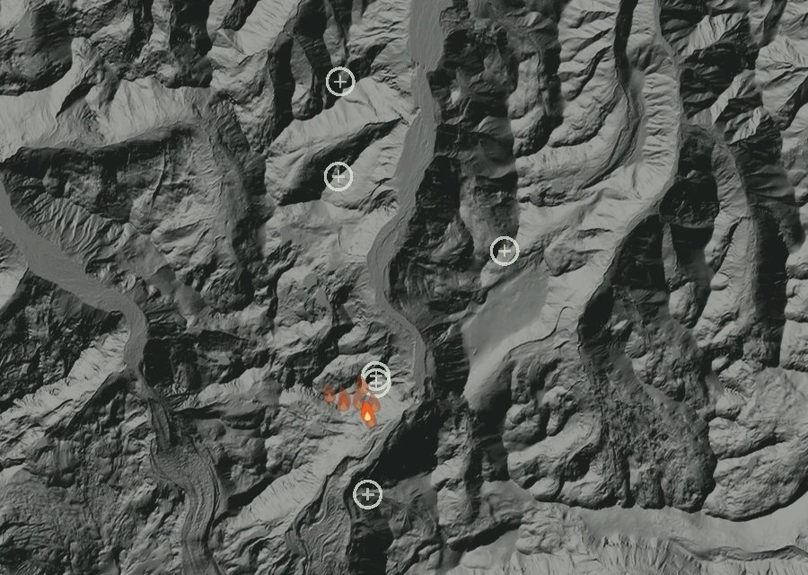 Shaded relief map of the Sluiskin Fire. Amber flames mark every place that gave off heat in the last day; the shading is the shape of the ground.