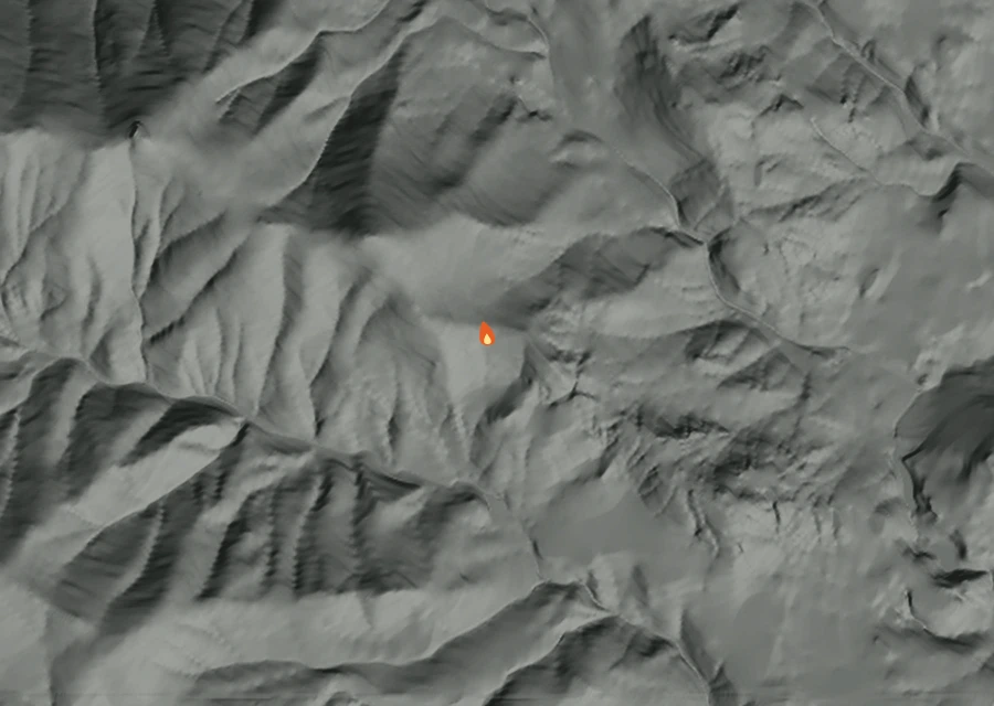 Shaded relief map of the Smalle Creek Fire. Amber flames mark every place that gave off heat in the last day; the shading is the shape of the ground.