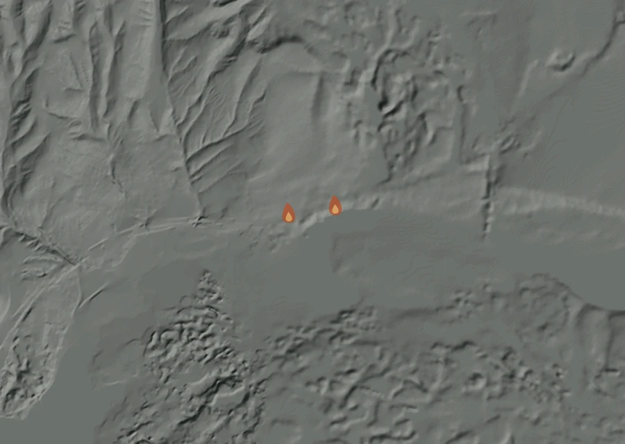 Shaded relief map of the Sprague Fire. Amber flames mark every place that gave off heat in the last day; the shading is the shape of the ground.