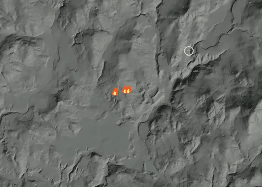Shaded relief map of the Starvation Flat Fire. Amber flames mark every place that gave off heat in the last day; the shading is the shape of the ground.