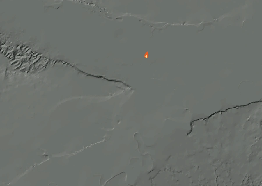 Shaded relief map of the Tabacco Fire. Amber flames mark every place that gave off heat in the last day; the shading is the shape of the ground.