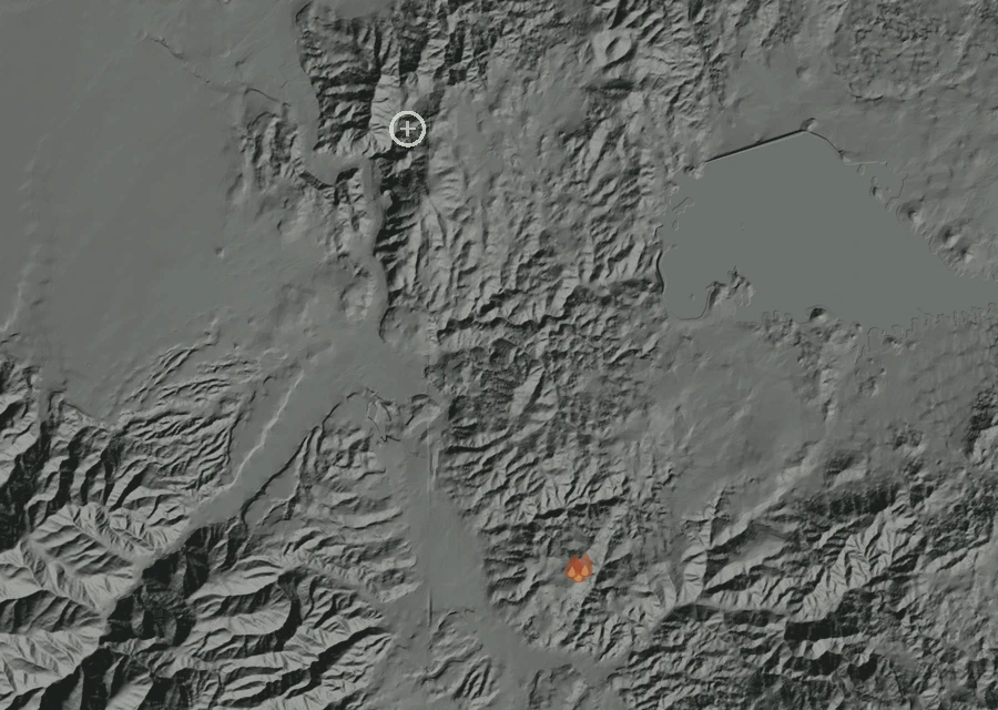 Shaded relief map of the Temescal Canyon Rd / Dos Lagos Dr Fire. Amber flames mark every place that gave off heat in the last day; the shading is the shape of the ground.
