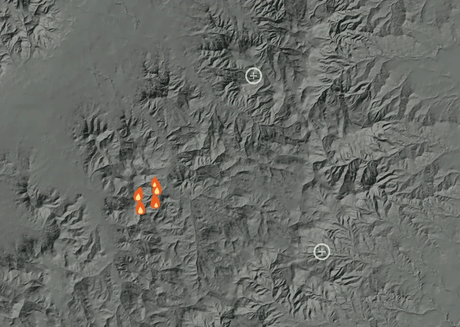 Shaded relief map of the Three Springs Fire. Amber flames mark every place that gave off heat in the last day; the shading is the shape of the ground.
