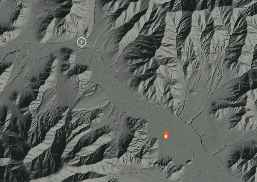 Shaded relief map of the Williams Hwy 12591 Fire. Amber flames mark every place that gave off heat in the last day; the shading is the shape of the ground.